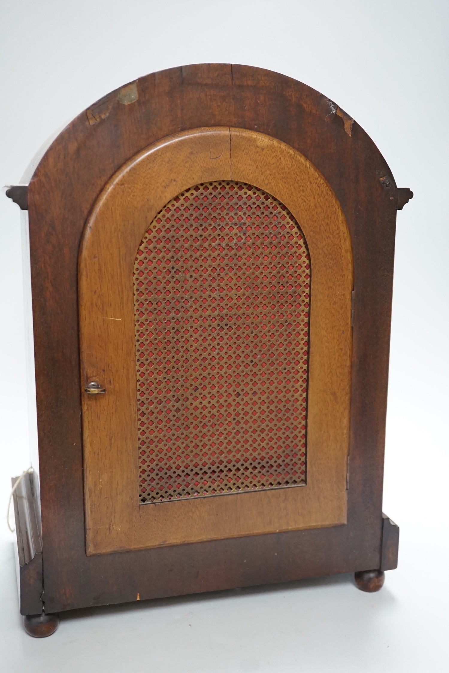 A late 19th/early 20th century mahogany mantel clock with German striking movement and convex silvered dial. 38cm tall